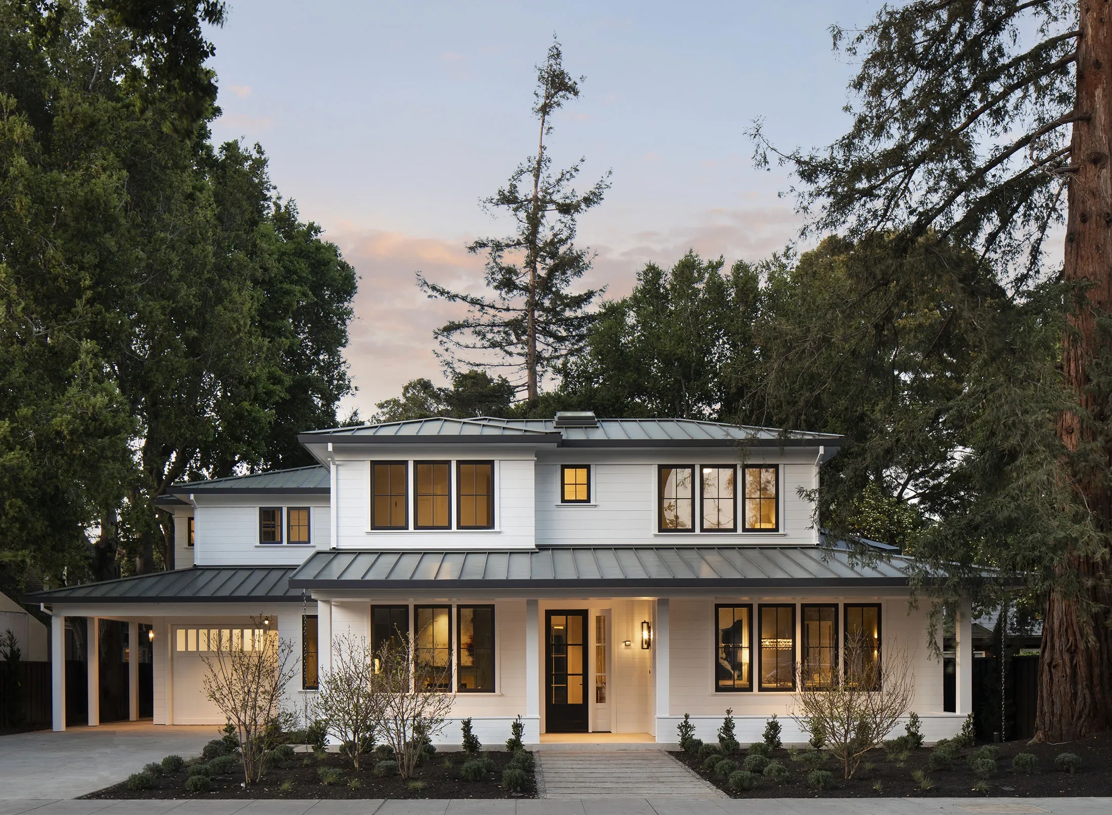 Byron by GHG Builders — front elevation at dusk framed by redwoods